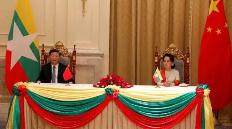Chinese President Xi Jinping and Myanmar State Counselor Aung San Suu Kyi attend a signing ceremony of a memorandum of understanding (MOU) 